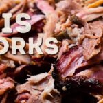 Smoked pulled pork shredded with bark on a board
