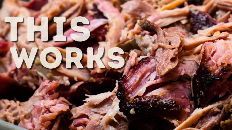 Smoked pulled pork shredded with bark on a board