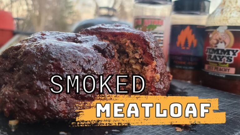 Sliced smoked meatloaf with a glaze and smoke ring